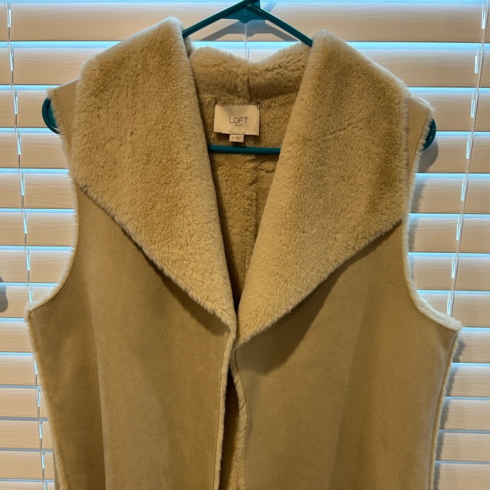 Very soft fury vest. Size medium color tan.